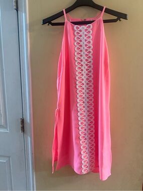Lilly Pulitzer Pearl Romper in a coral pink color with white lace detail, size 8
